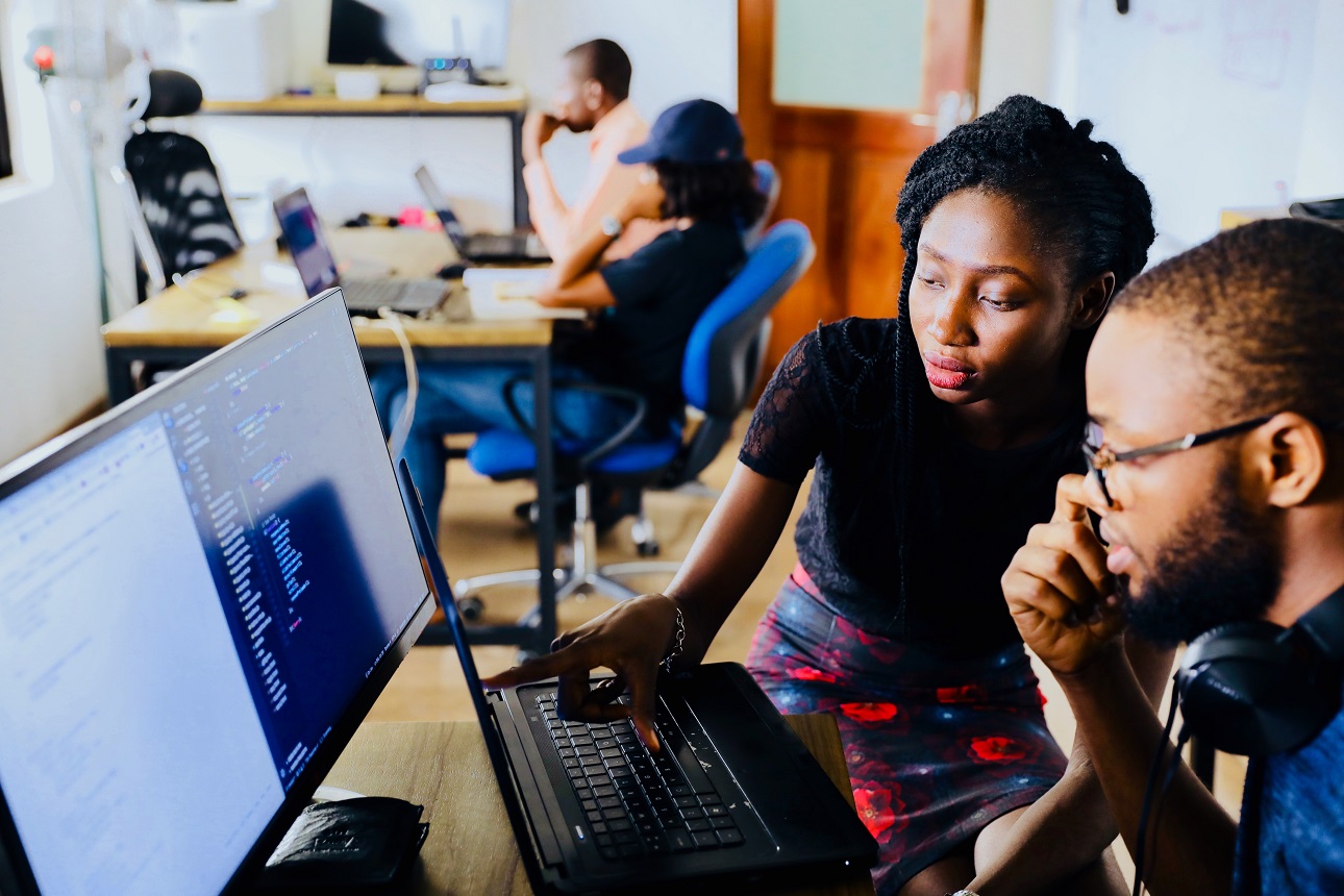 black teacher facilitating online learning -unsplash